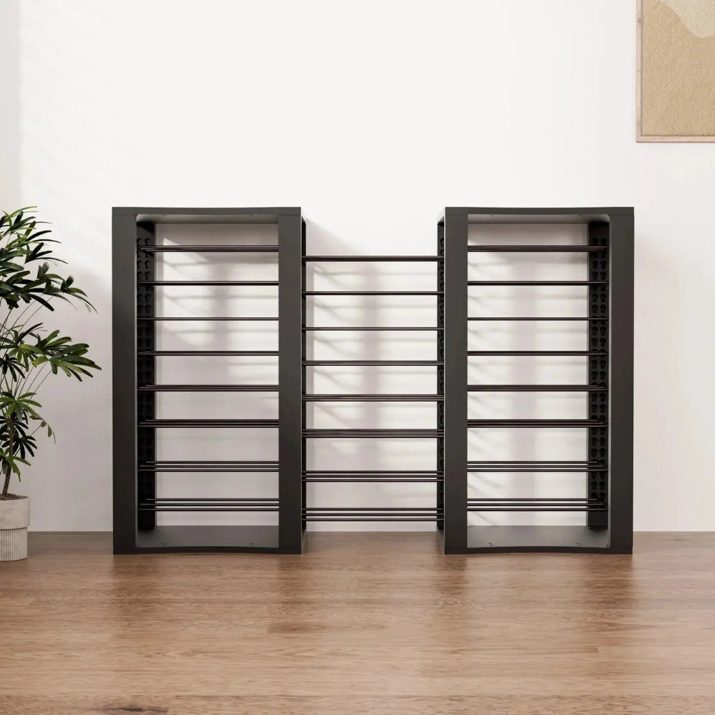 Empty BoardForge rack in Forge Black next to a plant